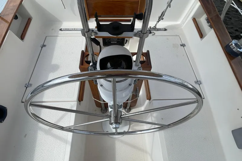 Slide: The Image of Cockpit of 1987 Com-Pac 27 sailboat with stainless steel steering wheel. - 6