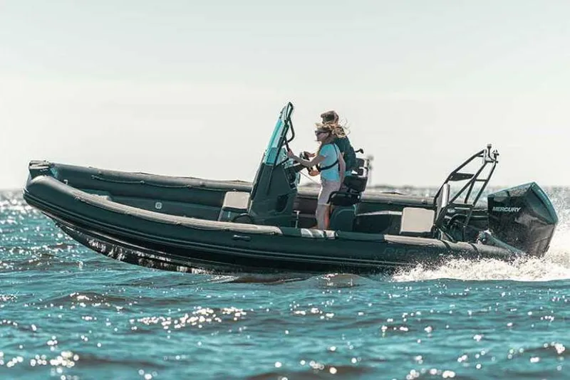 Slide: The Image of Manufacturer Provided Image: Zodiac Pro 7 boat 2026 on water with two people. - 0