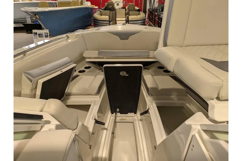 Slide: The Image of 2025 Sailfish 276 DC boat interior with beige seating and storage compartments. - 10
