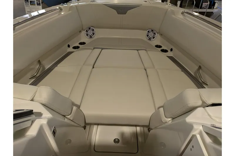 Slide: The Image of 2025 Sailfish 276 DC boat interior with beige seating and cup holders. - 11