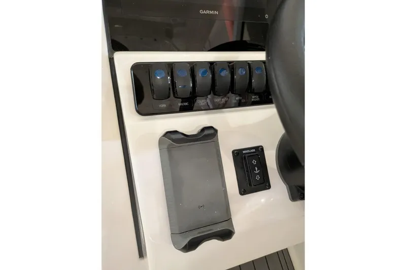 Slide: The Image of Control panel of 2025 Sailfish 276 DC boat with switches and windlass control. - 16