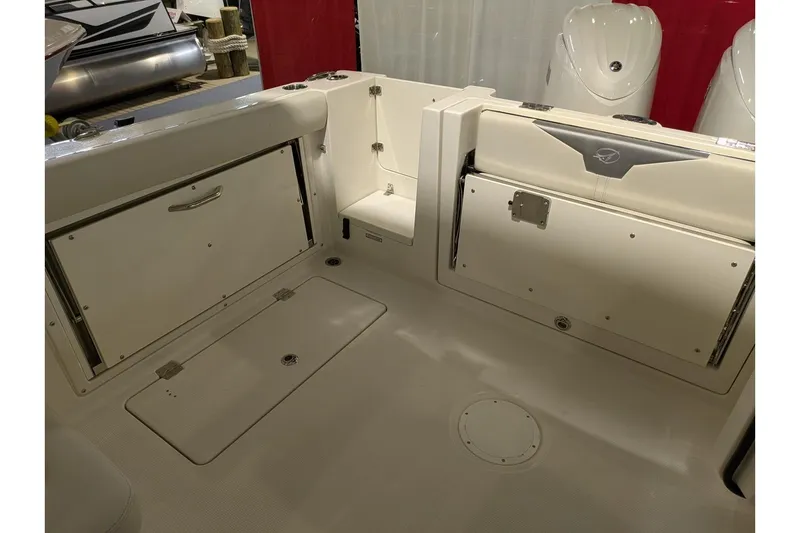 Slide: The Image of 2025 Sailfish 276 DC boat interior with storage compartments and seating. - 23