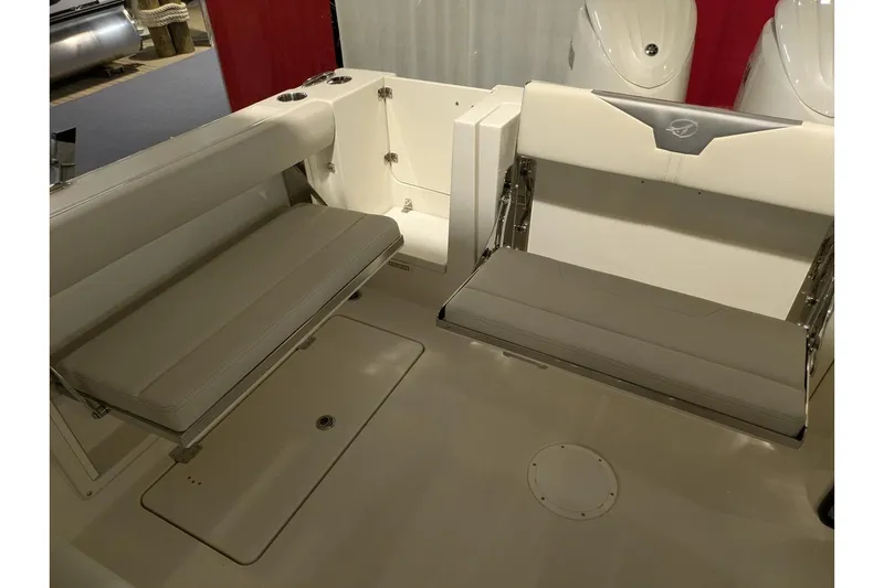 Slide: The Image of 2025 Sailfish 276 DC boat interior with foldable seating and storage compartments. - 24