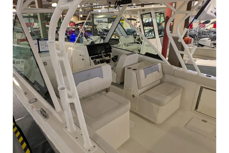 Slide: The Image of 2025 Sailfish 276 DC boat interior with seating and helm station. - 25