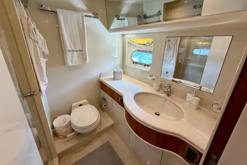 Slide: The Image of Luxurious yacht bathroom with elegant fixtures, towel rack, and ocean-view window on Horizon 92. - 100