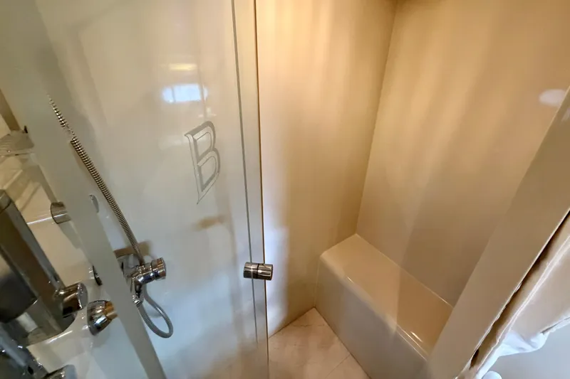 Slide: The Image of Luxurious shower area in Horizon 92 yacht with sleek design and chrome fixtures. - 103