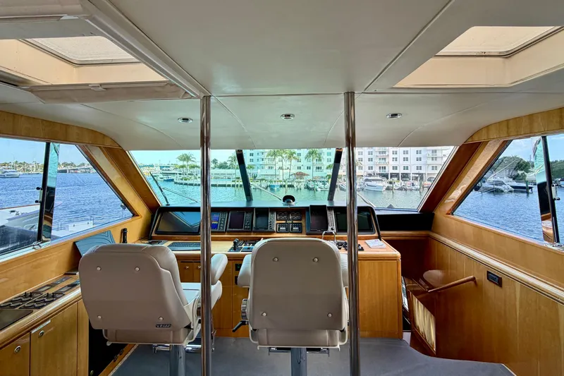 Slide: The Image of Interior view of Horizon 92 yacht cockpit with panoramic windows and modern navigation equipment. - 107