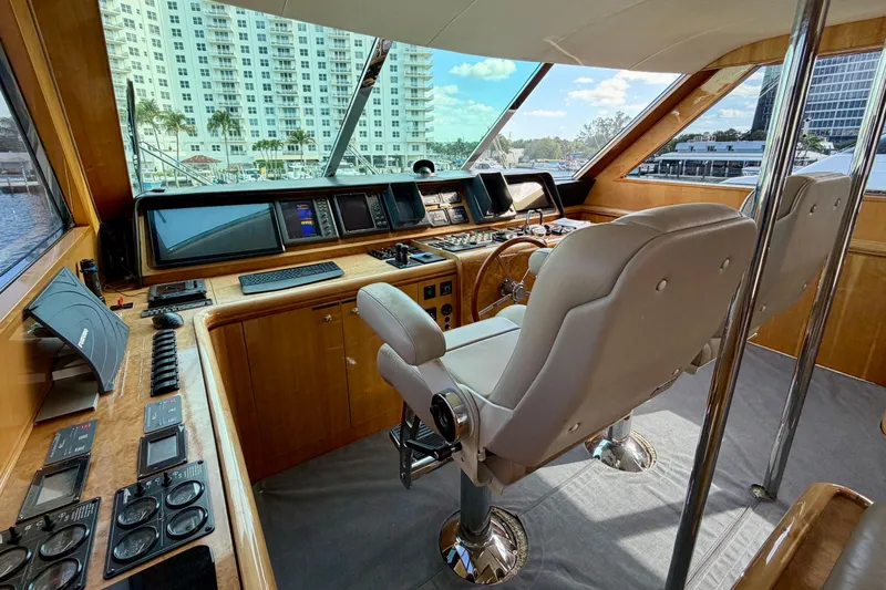 Slide: The Image of Luxurious Horizon 92 yacht cockpit with modern navigation equipment and plush seating. - 108