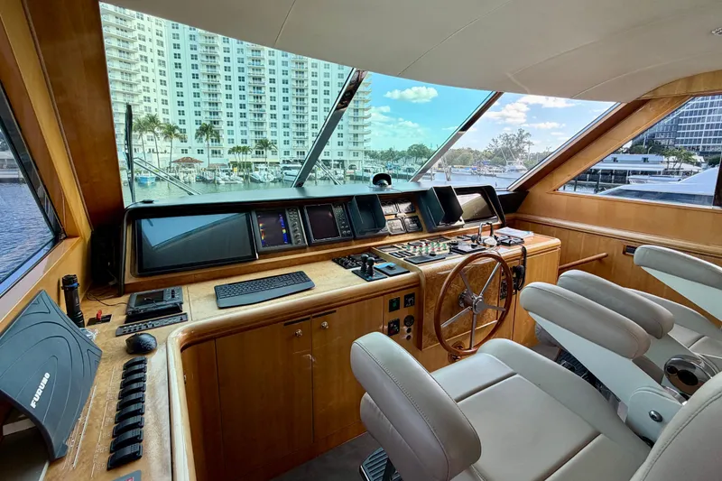 Slide: The Image of Luxurious Horizon 92 yacht helm with modern controls and panoramic marina view. - 109
