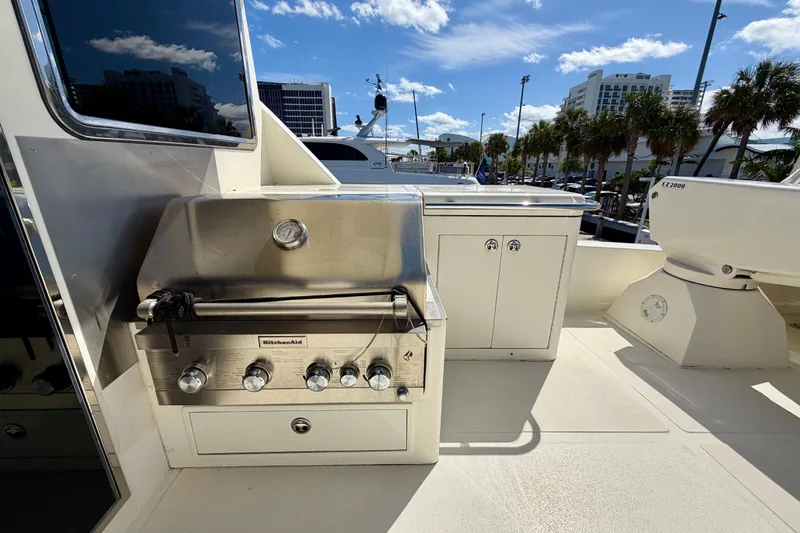 Slide: The Image of Outdoor grill on Horizon 92 yacht deck, with stainless steel finish and storage cabinets. - 123