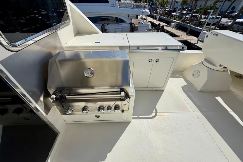 Slide: The Image of Outdoor kitchen on Horizon 92 yacht with stainless steel grill and storage cabinets. - 124