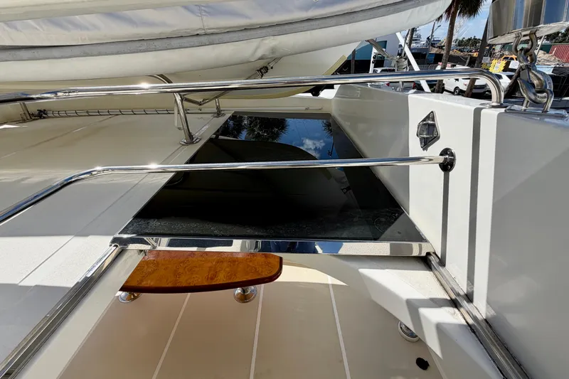 Slide: The Image of Luxury yacht Horizon 92 deck with polished railings and wooden step. - 132