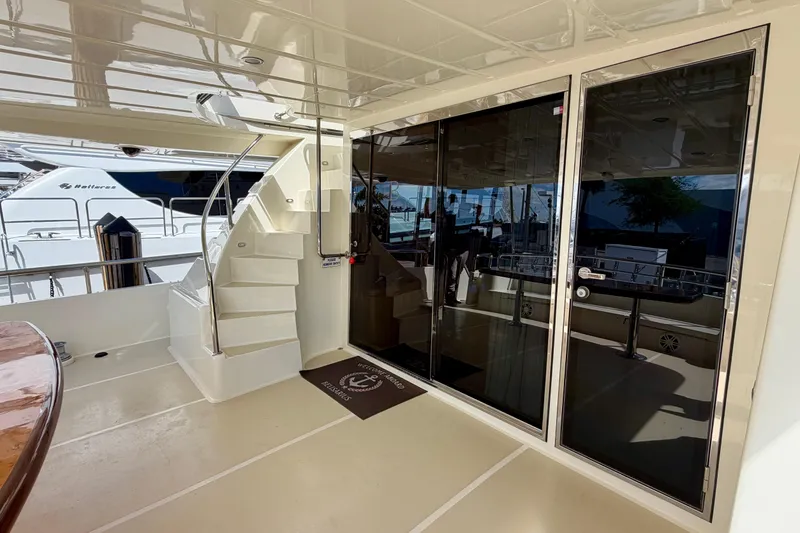 Slide: The Image of Luxury yacht Horizon 92 deck with stairs and glass doors. - 135
