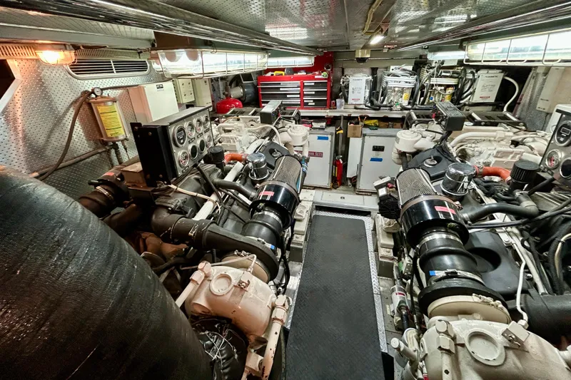 Slide: The Image of Engine room of Horizon 92 yacht with dual engines and control panels. - 139
