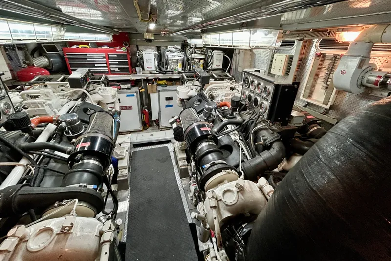 Slide: The Image of Engine room of Horizon 92 yacht with dual engines and control panels. - 140
