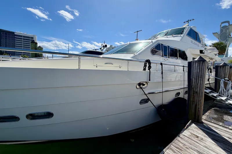 Slide: The Image of Luxury Horizon 92 yacht docked under clear blue sky. - 146
