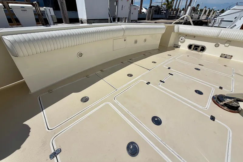 Slide: The Image of Spacious deck of Horizon 92 yacht with storage compartments and cushioned seating. - 18