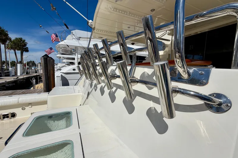 Slide: The Image of Luxury Horizon 92 yacht deck with fishing rod holders and American flags. - 19