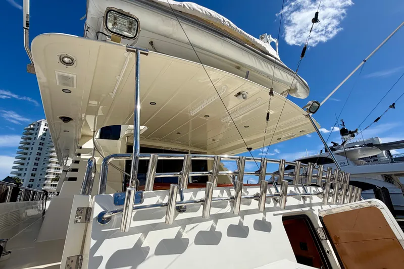 Slide: The Image of Luxury Horizon 92 yacht with sleek design and modern amenities, docked under a clear blue sky. - 23