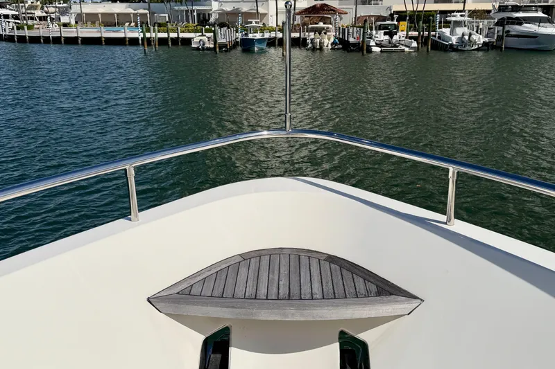 Slide: The Image of Bow view of Horizon 92 yacht docked in a marina. - 32