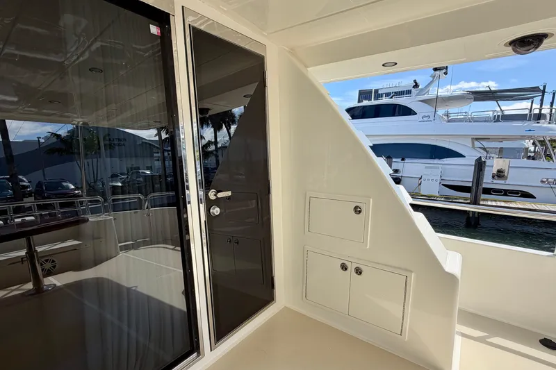 Slide: The Image of Luxurious Horizon 92 yacht interior with sleek design and modern amenities, docked at marina. - 39