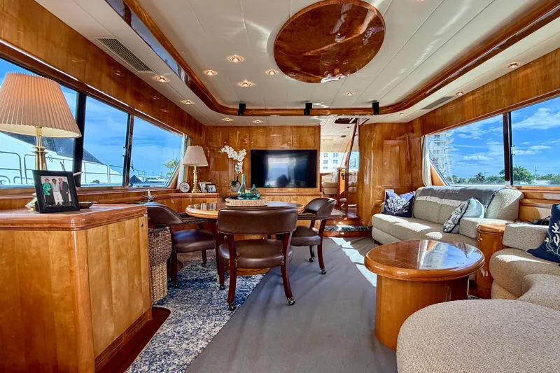 Slide: The Image of Luxurious Horizon 92 yacht interior with elegant wood finishes and plush seating. - 43