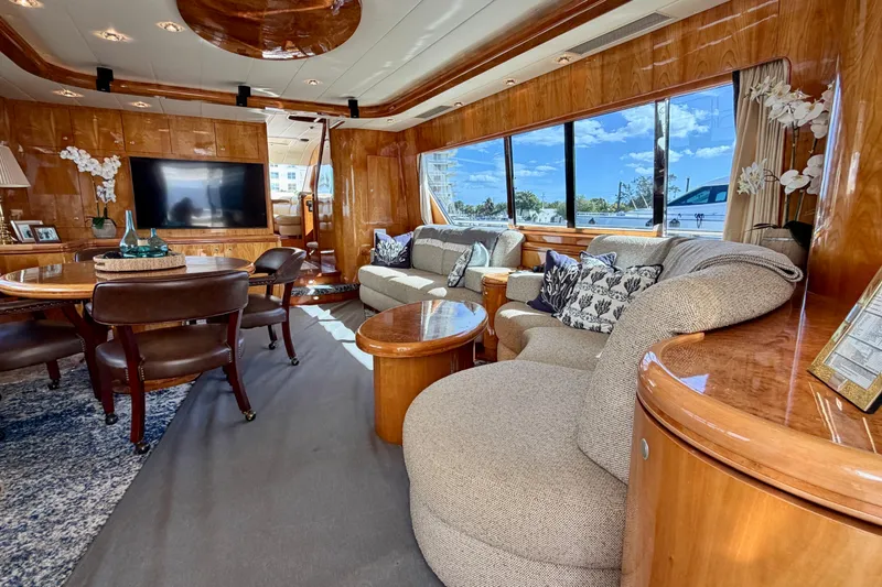 Slide: The Image of Luxurious Horizon 92 yacht interior with elegant wood finishes and plush seating. - 44