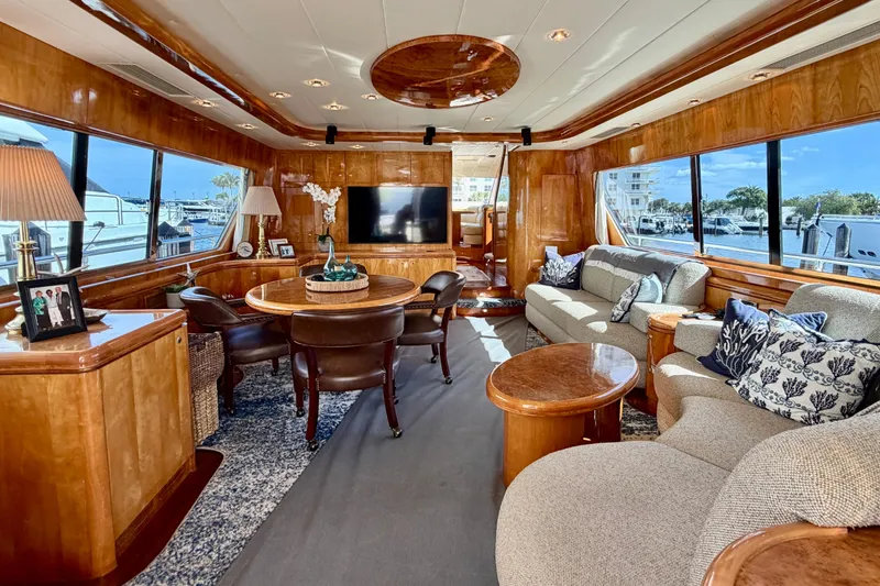 Slide: The Image of Luxurious Horizon 92 yacht interior with elegant wood finishes and plush seating. - 46