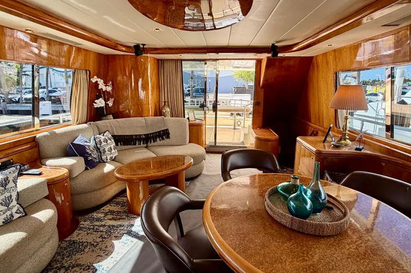 Slide: The Image of Luxurious Horizon 92 yacht interior with elegant wood finishes and comfortable seating. - 49