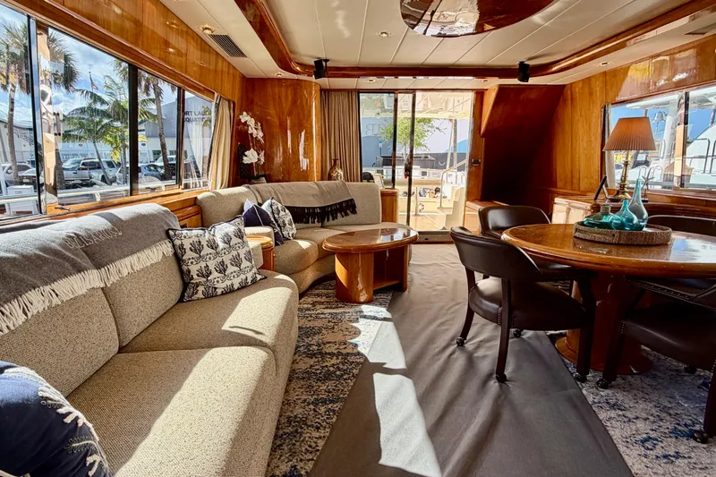 Slide: The Image of Luxurious Horizon 92 yacht interior with elegant seating, wooden accents, and large windows. - 51