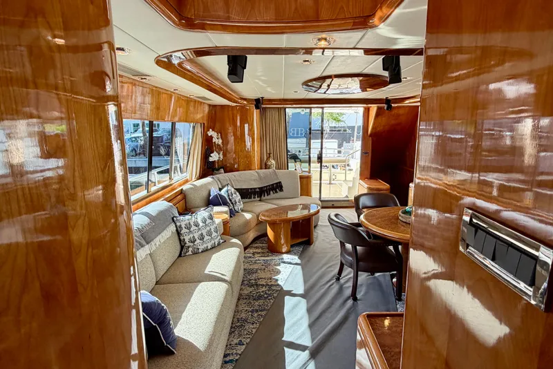 Slide: The Image of Luxurious Horizon 92 yacht interior with elegant wood paneling and plush seating. - 52