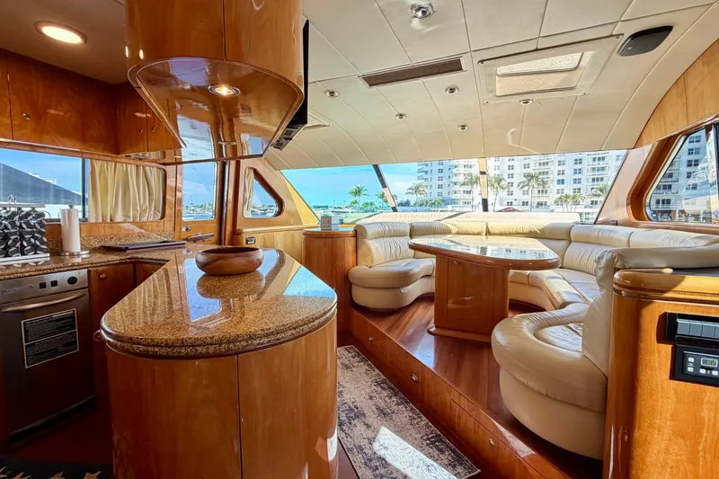 Slide: The Image of Luxurious Horizon 92 yacht interior with elegant wood finishes and plush seating. - 59