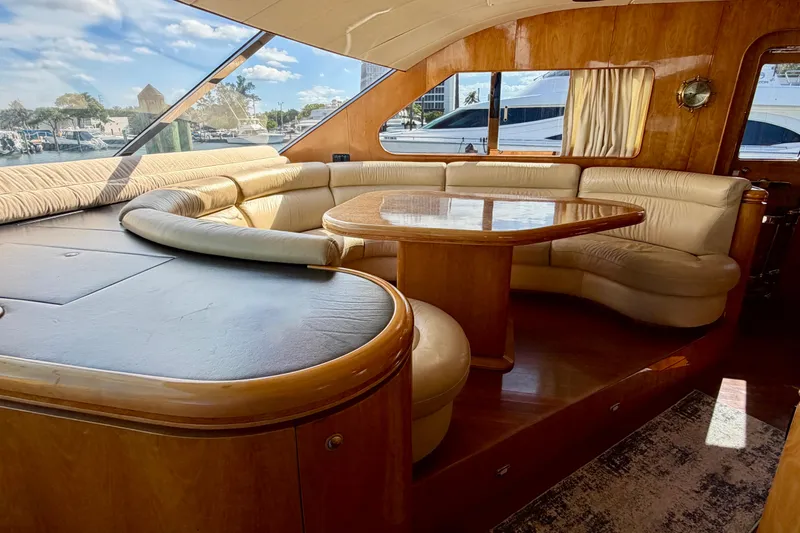 Slide: The Image of Luxurious yacht interior with curved leather seating and wooden table, Horizon 92 model. - 61