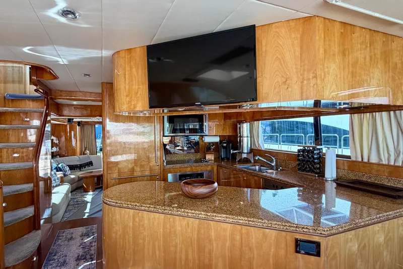 Slide: The Image of Luxurious Horizon 92 yacht interior with modern kitchen, wooden finishes, and elegant staircase. - 62
