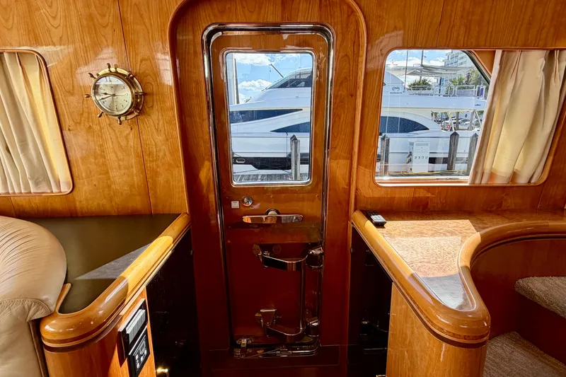 Slide: The Image of Luxurious Horizon 92 yacht interior with polished wood finish and nautical decor. - 63