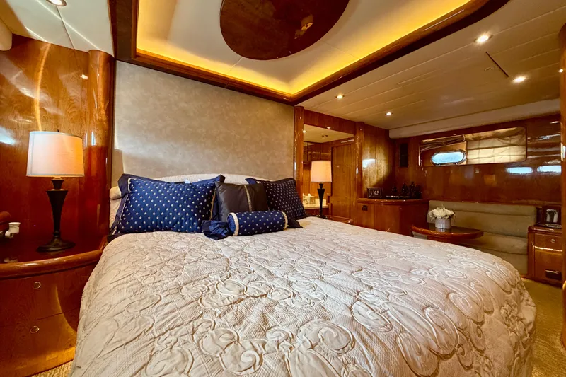Slide: The Image of Luxurious bedroom interior on Horizon 92 yacht with elegant bedding and warm lighting. - 68