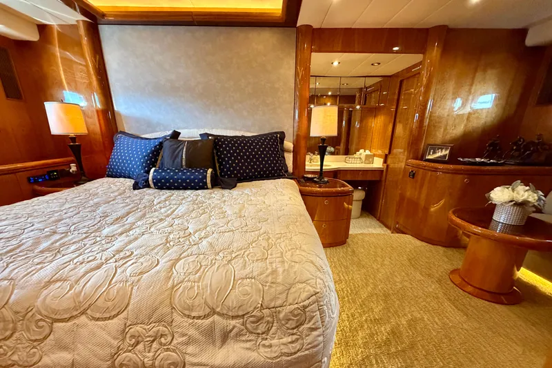 Slide: The Image of Luxurious yacht bedroom with elegant bedding and polished wood furnishings, Horizon 92 model. - 69