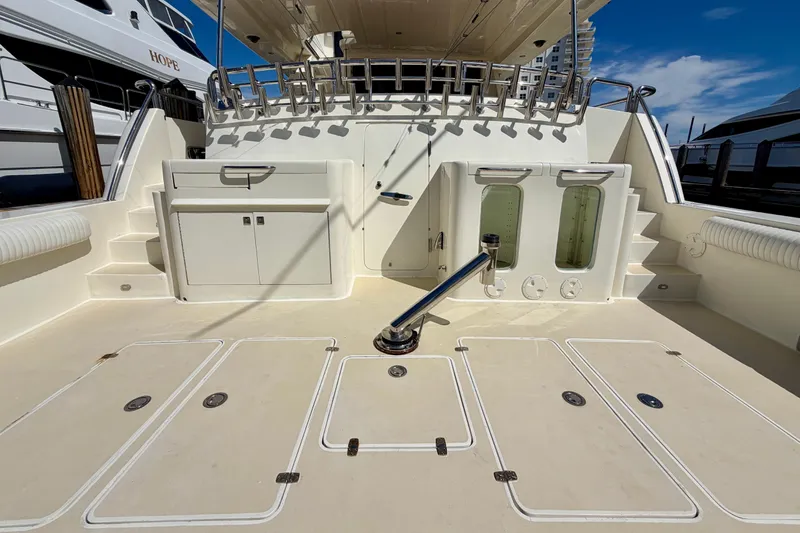 Slide: The Image of Spacious deck of Horizon 92 yacht with storage compartments and seating. - 7