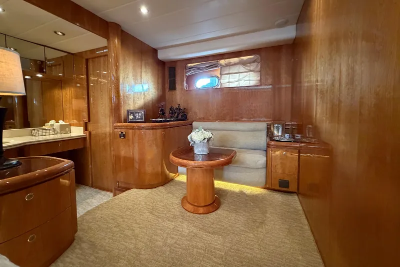 Slide: The Image of Luxurious Horizon 92 yacht interior with wooden paneling, cozy seating, and elegant decor. - 70