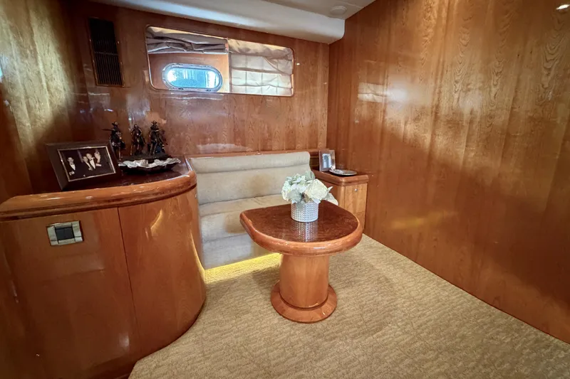 Slide: The Image of Luxurious yacht interior with wooden paneling, cozy seating, and elegant decor on a Horizon 92. - 71