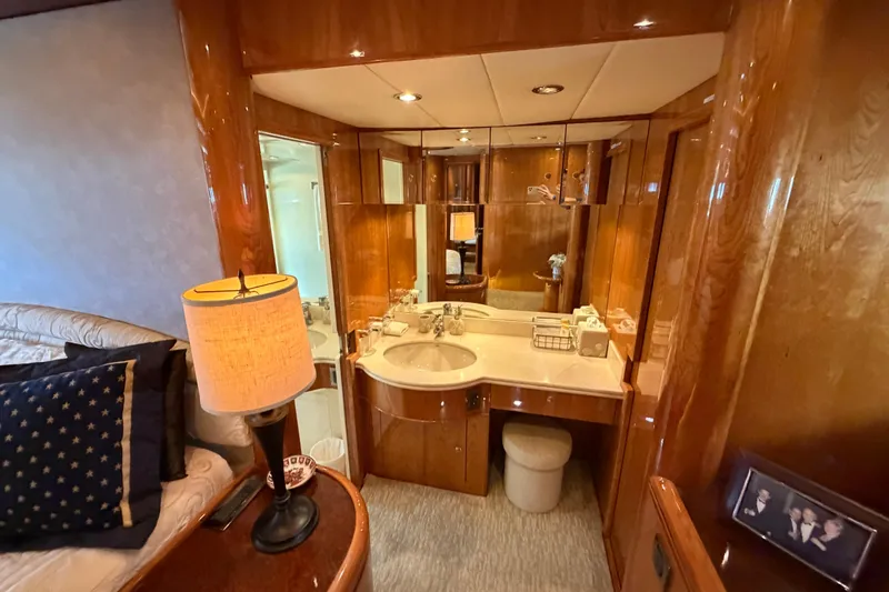 Slide: The Image of Luxurious Horizon 92 yacht interior with elegant wood finishes and cozy lighting. - 72