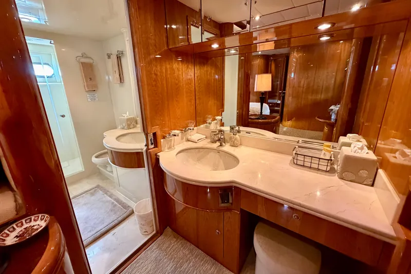 Slide: The Image of Luxurious yacht bathroom with wooden cabinetry and marble countertop on Horizon 92. - 73