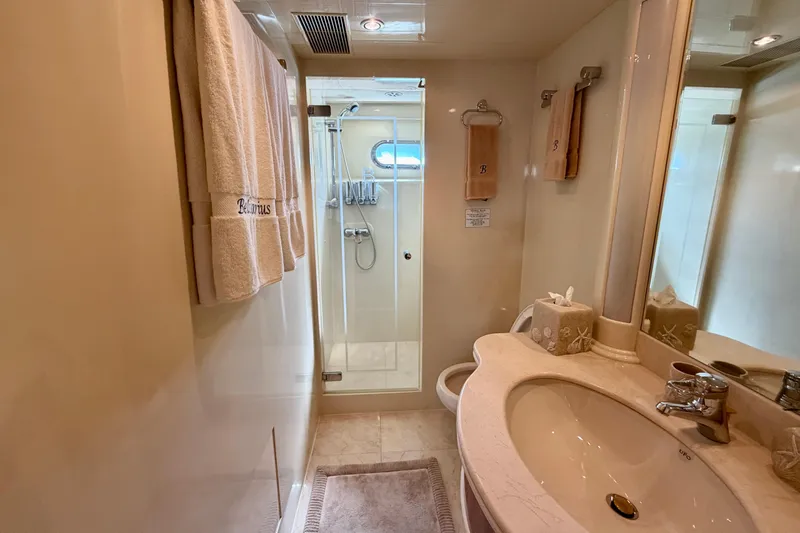 Slide: The Image of Luxurious yacht bathroom with shower, sink, and towels on Horizon 92 model. - 74