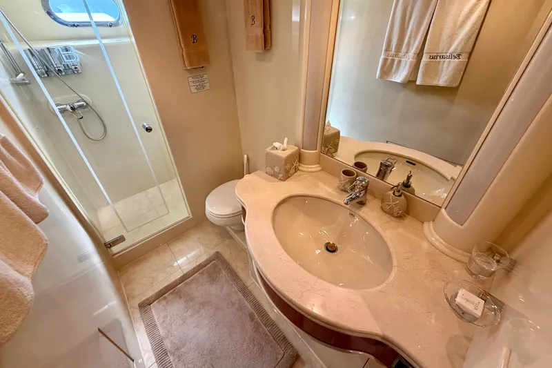 Slide: The Image of Luxurious yacht bathroom with shower, sink, and elegant fixtures on Horizon 92 model. - 75