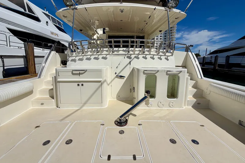Slide: The Image of Luxury Horizon 92 yacht deck with storage compartments and fishing rod holders. - 8