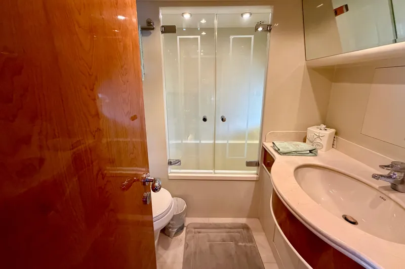 Slide: The Image of Luxurious bathroom on Horizon 92 yacht with glass shower and elegant fixtures. - 89