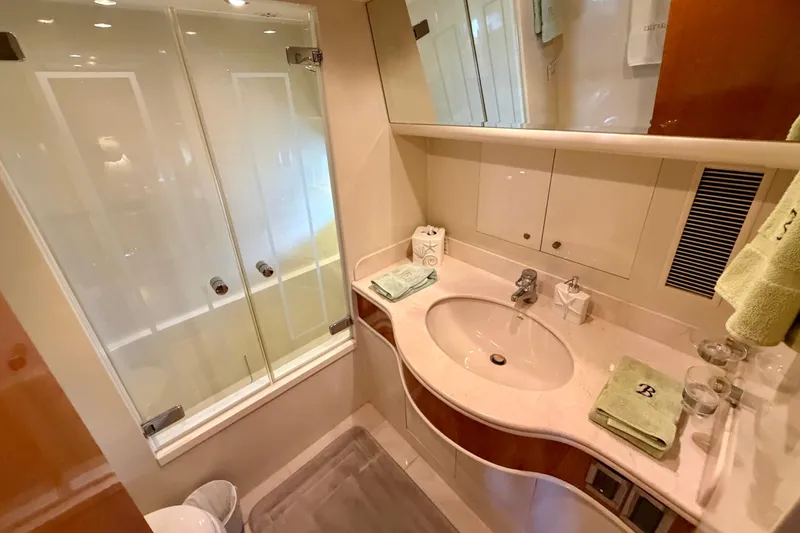 Slide: The Image of Luxurious bathroom in Horizon 92 yacht with modern fixtures and glass shower. - 90