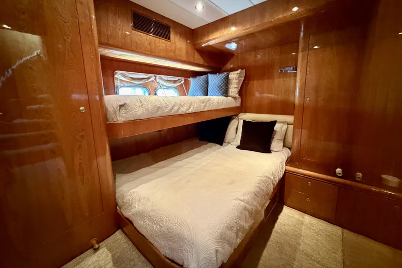 Slide: The Image of Luxurious cabin interior with wooden finish and bunk beds on Horizon 92 yacht. - 96