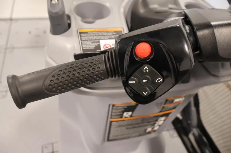 Slide: The Image of Close-up of 2023 Sea-Doo Switch Sport 21 handlebar controls with buttons and grip. - 13