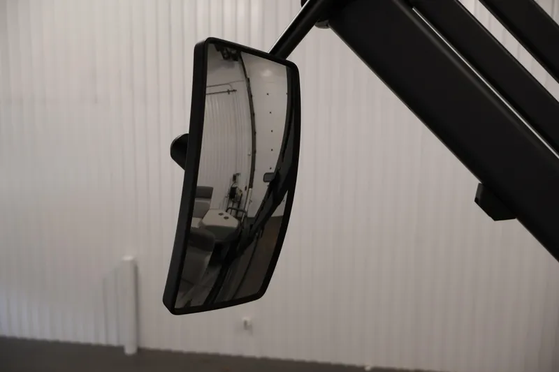 Slide: The Image of 2023 Sea-Doo Switch Sport 21 rearview mirror in a garage setting. - 16